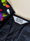 Bustier in cotone nero ricamato con fiori e paillettes e piccole coccarde multicolor “Giorgio Kauten”