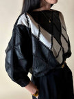 Blusa vintage in pelle nera e bianca patchwork con lavorazione crochet e maniche a pipistrello