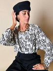 Maxi orecchini a clip dorati con logo YSL 