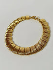 Collier vintage oro con elementi geometrici striati