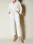 Jumpsuit vintage Spengler Mode in viscosa jacquard avorio con scollo drappeggiato