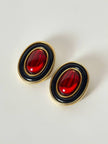 Orecchini a clip vintage in metallo oro con cabochon rosso e profili neri