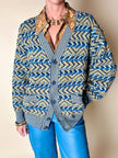 Cardigan Missoni Sport con pattern geometrico e trama tridimensionale nei toni del verde e blu