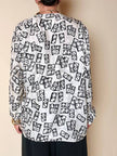 Blusa Yves Saint Laurent in tessuto jacquard bianco e nero fantasia Domino
