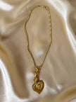 Collana dorata con ciondolo pendente a cuoricini “Yves Saint Laurent”