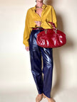 Borsa in pelle rosso bruciato con manici a treccia