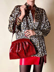 Pochette in whips rossa con tracolla regolabile