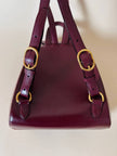 Sac à dos Must de Cartier en cuir bordeaux avec finitions dorées