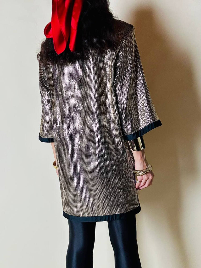 Mini dress oro in tessuto operato con profili neri in raso nero  “Yves Saint Laurent”