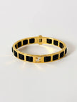 Bracciale vintage Fendi in metallo dorato con inserti in pelle nera intrecciata