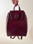 Sac à dos Must de Cartier en cuir bordeaux avec finitions dorées