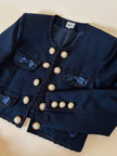 Bolero blu con bottoni gioiello e fiocchi “Max Dinè”