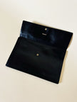 Pochette vintage Yves Saint Laurent in pelle nera con greca logata in rilievo