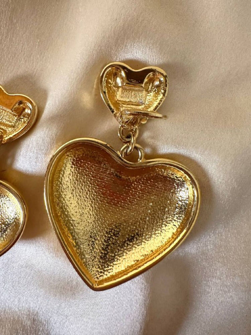 Maxi clip oro con cuori pendenti “Moschino”