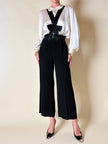 Pantalone nero con bretelle e maxi fiocchi in raso “Moschino Cheap and Chic”