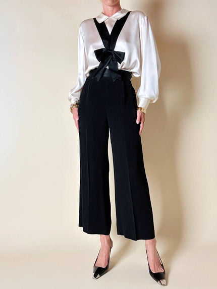 Pantalone nero con bretelle e maxi fiocchi in raso “Moschino Cheap and Chic”