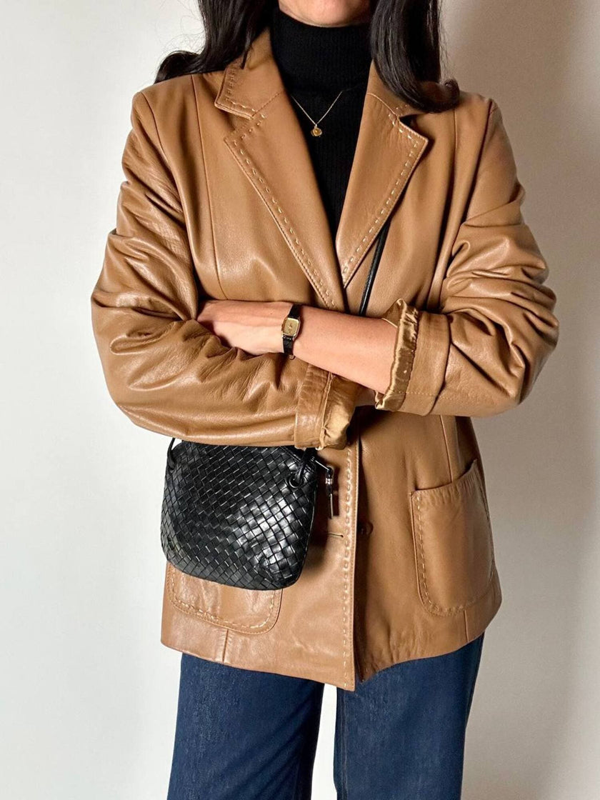 Vintage tan leather jacket with hand-stitched detailing by Claude Collections