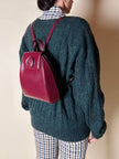 Sac à dos Must de Cartier en cuir bordeaux avec finitions dorées