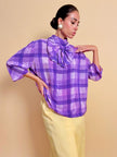 Blusa in seta lilla con maxi fiocco