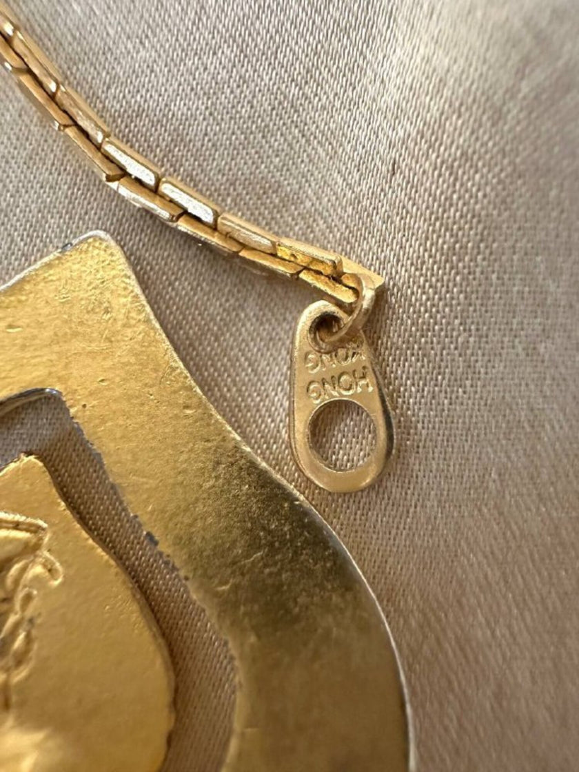 Collana dorata con ciondolo pendente a cuoricini “Yves Saint Laurent”