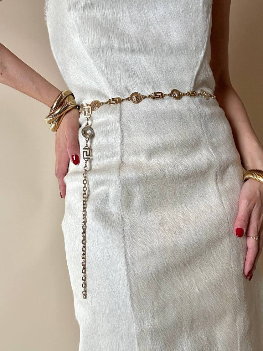 Cintura/collana dorata composta da greche e teste di leone