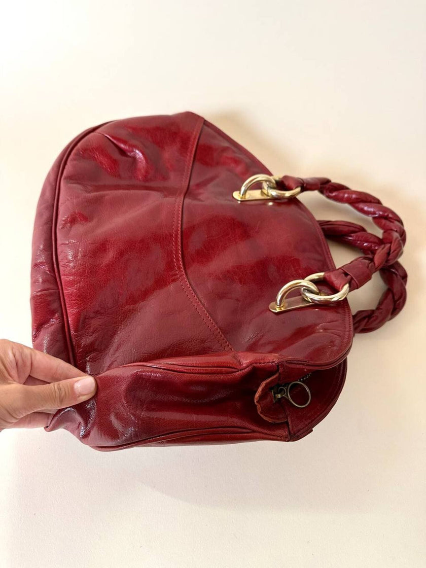 Borsa in pelle rosso bruciato con manici a treccia
