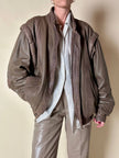 Bomber con maniche rimovibili in pelle color fango “Arpell”