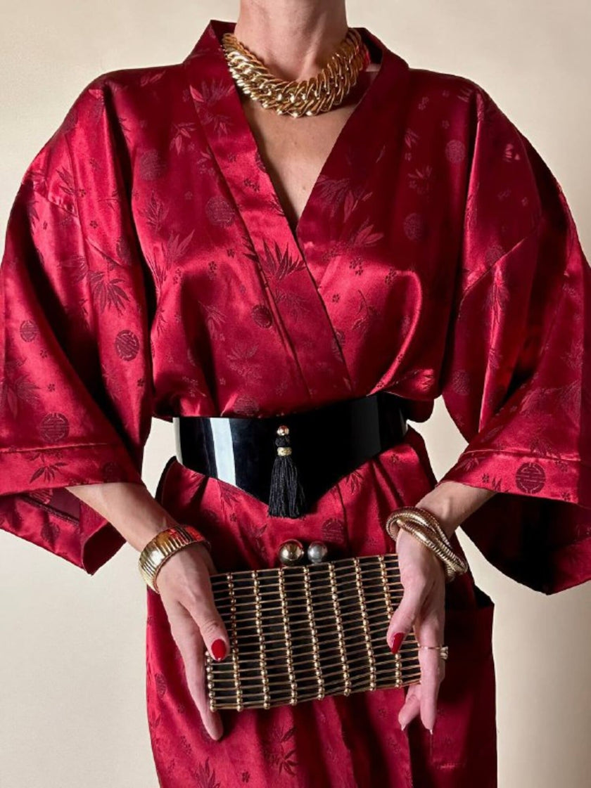 Clutch gioiello in seta nera con armatura di perline dorate “Rodo”
