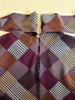 Bluse mit Schleifenkragen aus gemusterter Seide mit Rauten- und Hahnentritt-Details