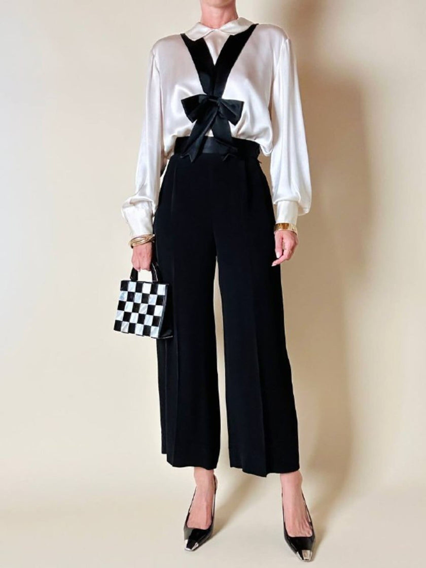 Pantalone nero con bretelle e maxi fiocchi in raso “Moschino Cheap and Chic”