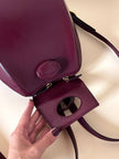 Sac à dos Must de Cartier en cuir bordeaux avec finitions dorées