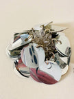 Parure composta da clip e mini bag in paillettes argento