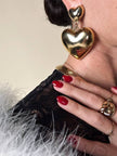 Maxi clip oro con cuori pendenti “Moschino”