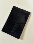 Pochette vintage Yves Saint Laurent in pelle nera con greca logata in rilievo