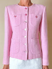 Blazer in lana bouclé rosa con bottoni gioiello logati in madreperla “Yves Saint Laurent”