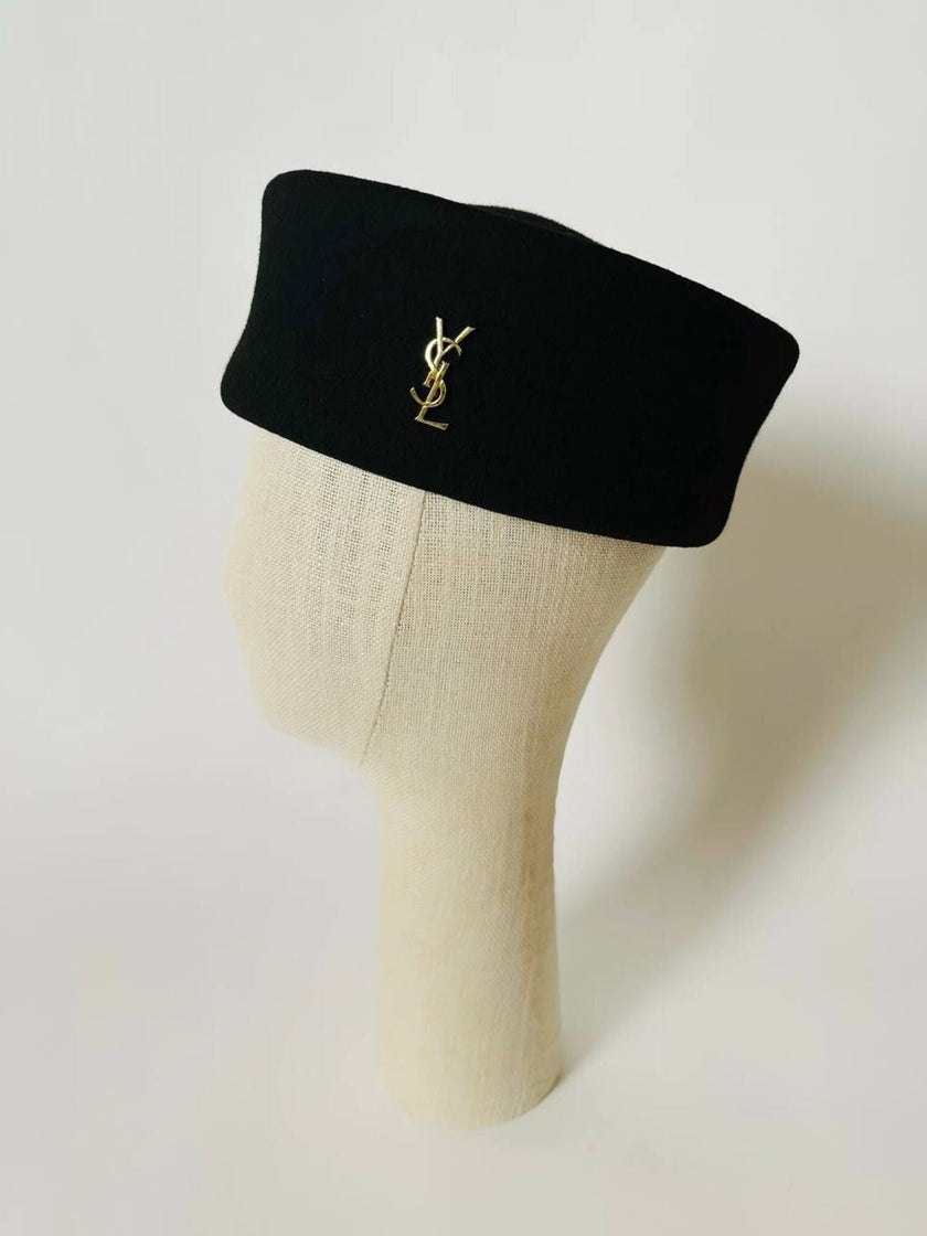 Vintage Yves Saint Laurent logo brooch in gold-tone metal