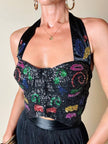 Schwarzes Satin-Bustier, bestickt mit schwarzen Pailletten mit mehrfarbigen Details