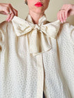Camicia in seta Jaquard avorio con grande fiocco al collo