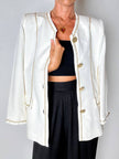 Giacca vintage Yves Saint Laurent bianco latte con serpentine dorate e bottoni gioiello
