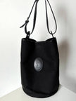 Secchiello vintage Yves Saint Laurent in tessuto nero millerighe con riporti in pelle