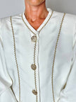 Giacca vintage Yves Saint Laurent bianco latte con serpentine dorate e bottoni gioiello