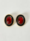 Orecchini a clip vintage in metallo oro con cabochon rosso e profili neri