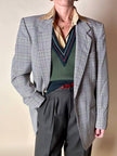 Gilet in lana verde prato con scollo a V e profili a contrasto verde bosco