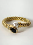 Bracciale vintage in metallo dorato con perla onice nero e cristalli
