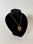 Collier vintage Yves Saint Laurent con ciondolo a forma di cuore firmato e cabochon rosso