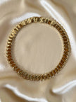 Collier dorato con moduli a onda