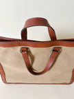 Borsa Yves Saint Laurent in canvas beige con profili color cuoio e motivo greca con logo