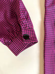 Camicia in seta a quadretti fucsia e neri con con fiocco al collo “Valentino”