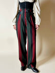 Pantalone a vita alta in lana jacquard a righe verticali con cinturini in pelle nera